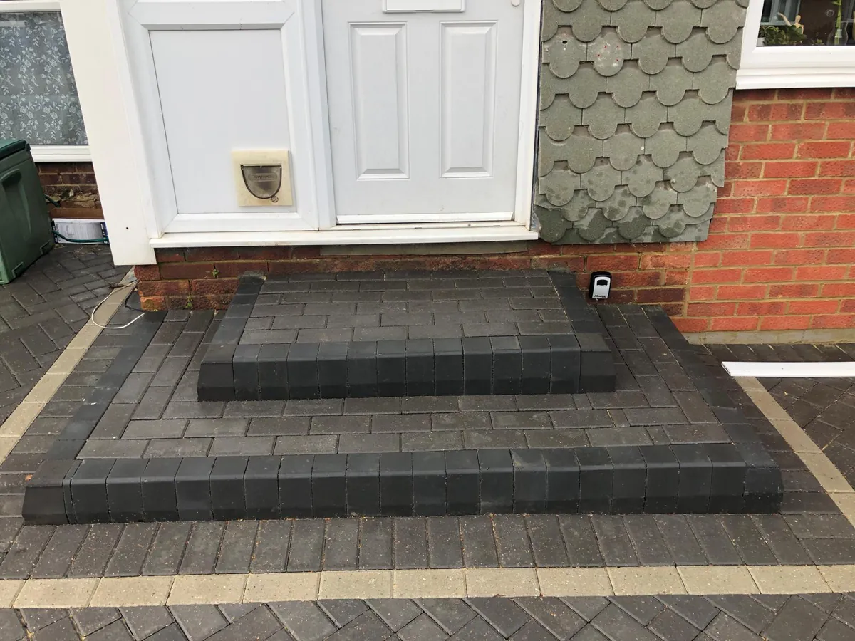 Charcoal block steps and landing built at a front door