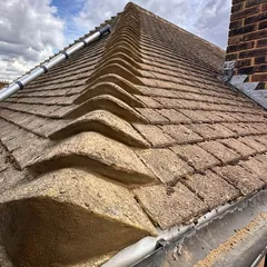 Hip tiles on one of our roofs, freshly rebedded in mortar